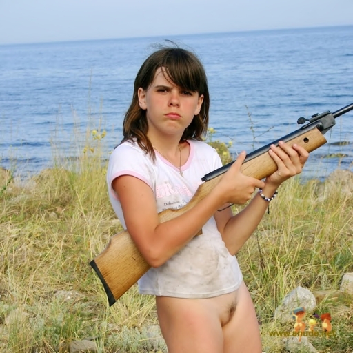 Young pussy with a rifle